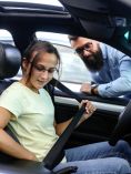 Girl putting on seatbelt